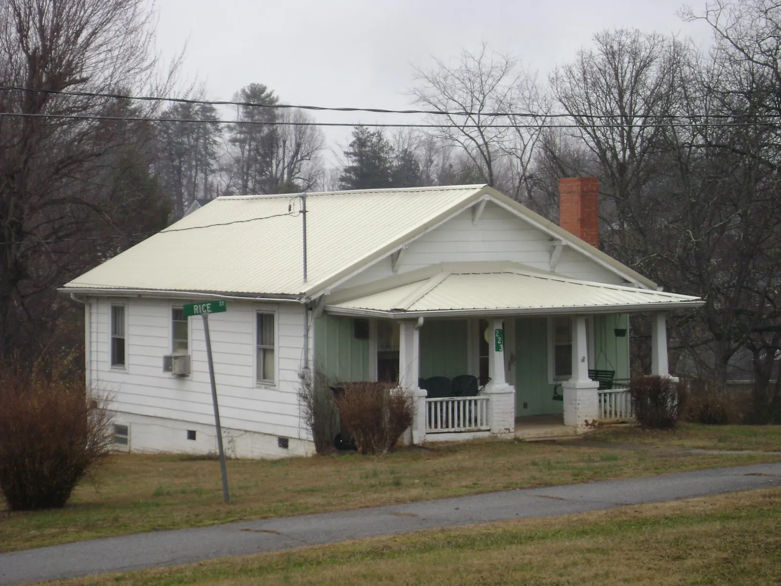 White metal roof on a craftsman bungalow at a street corner in Kenilworth